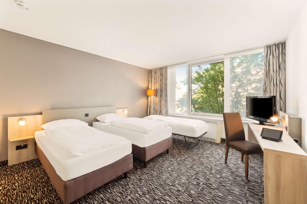 Postel nebo postele na pokoji v ubytování Best Western Plus Hotel Dresden City