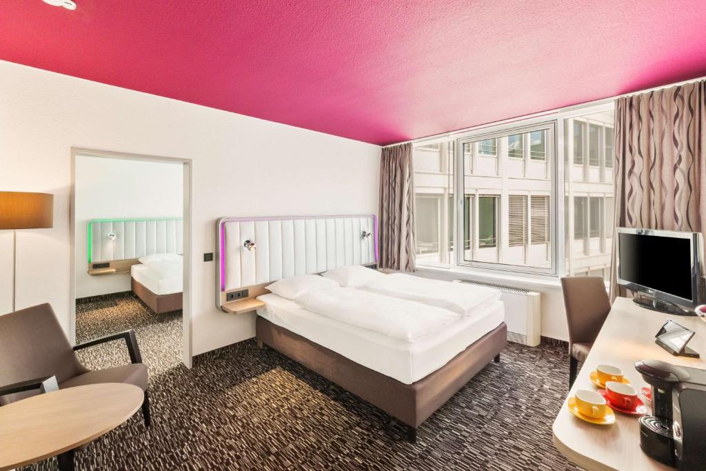 Postel nebo postele na pokoji v ubytování Best Western Plus Hotel Dresden City