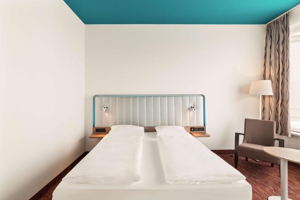 Postel nebo postele na pokoji v ubytování Best Western Plus Hotel Dresden City