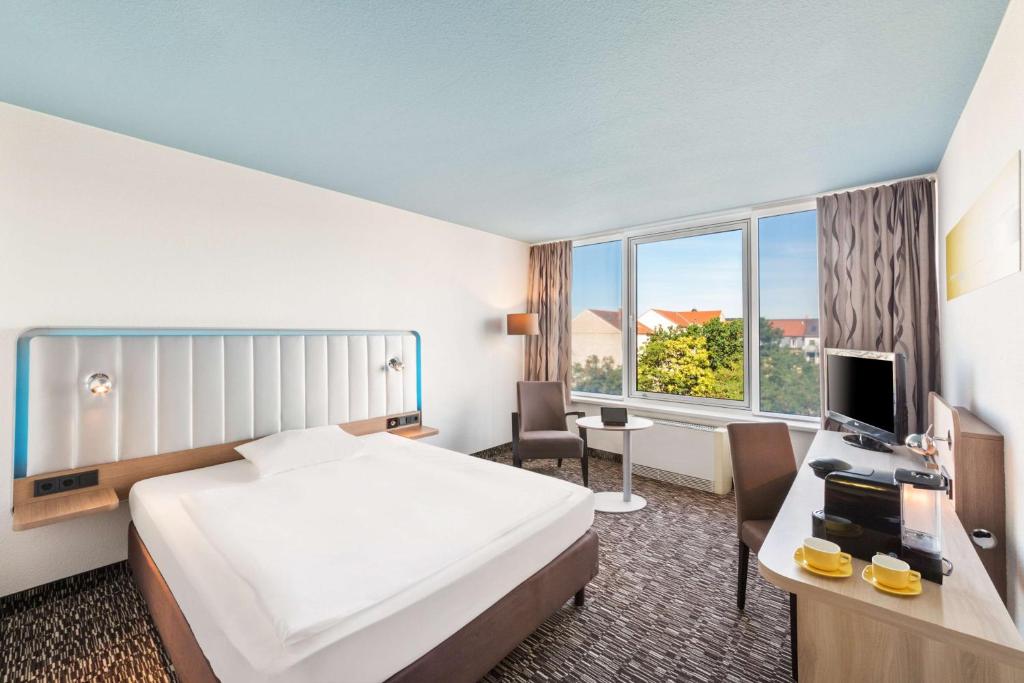 Postel nebo postele na pokoji v ubytování Best Western Plus Hotel Dresden City