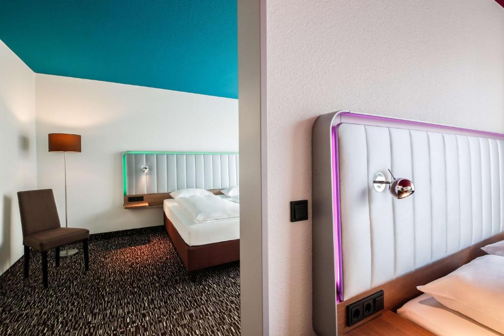 Postel nebo postele na pokoji v ubytování Best Western Plus Hotel Dresden City
