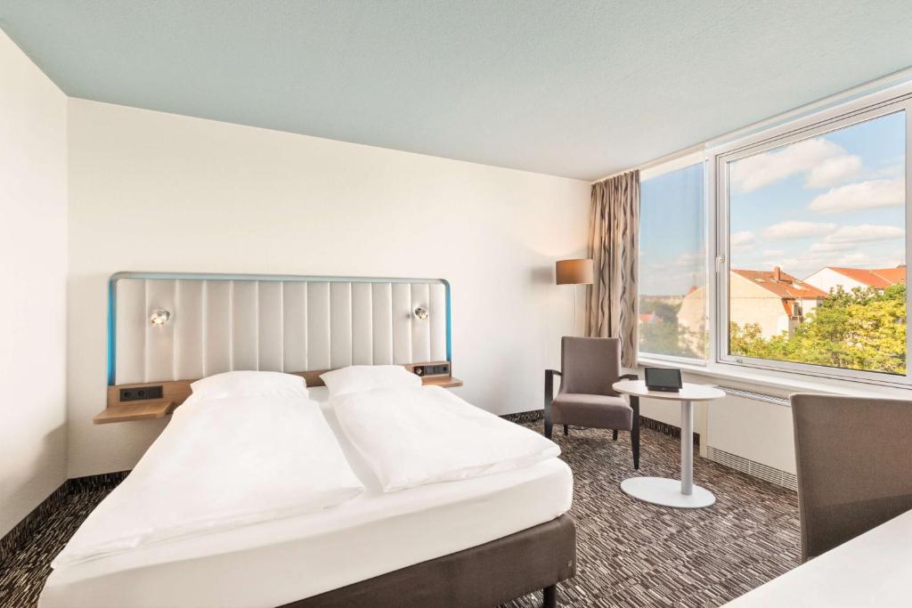 Postel nebo postele na pokoji v ubytování Best Western Plus Hotel Dresden City