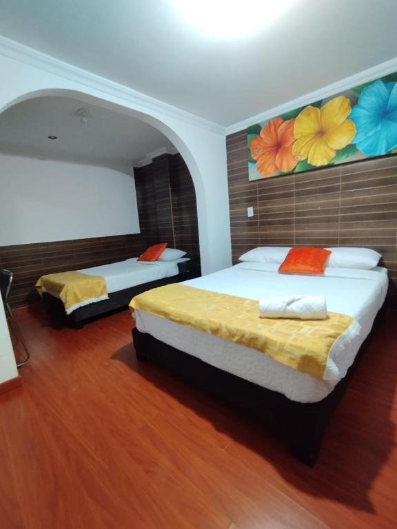 Postel nebo postele na pokoji v ubytování Hotel Ejecutivo 63 In