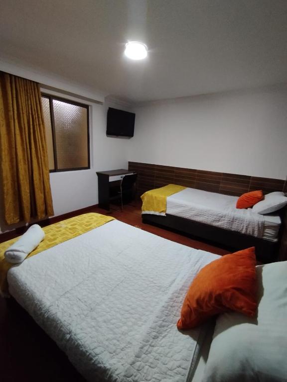 Postel nebo postele na pokoji v ubytování Hotel Ejecutivo 63 In