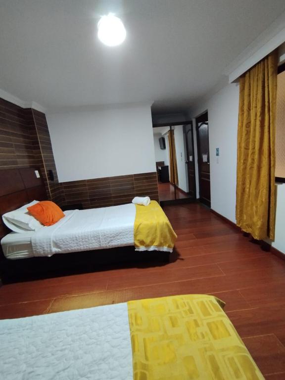 Postel nebo postele na pokoji v ubytování Hotel Ejecutivo 63 In