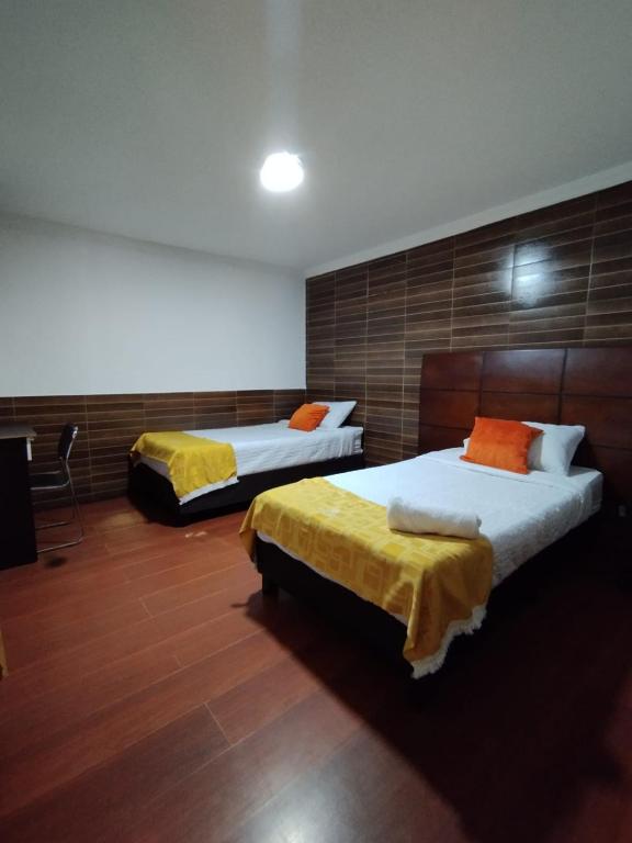 Postel nebo postele na pokoji v ubytování Hotel Ejecutivo 63 In
