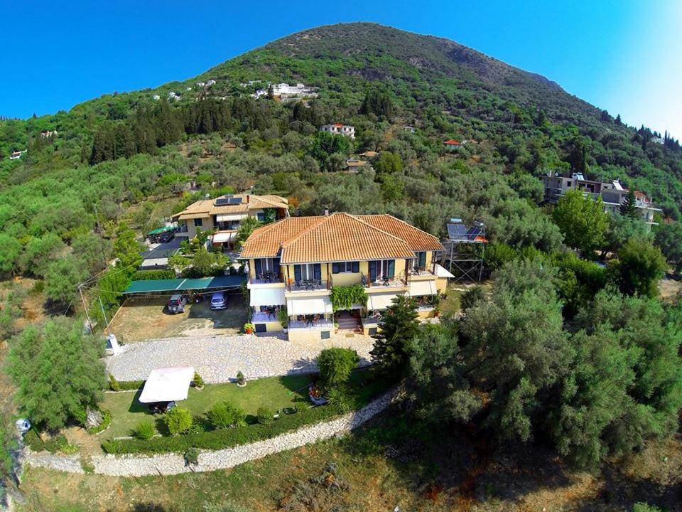 an aerial view of a house on a hill at Alexia Studios in Nydri