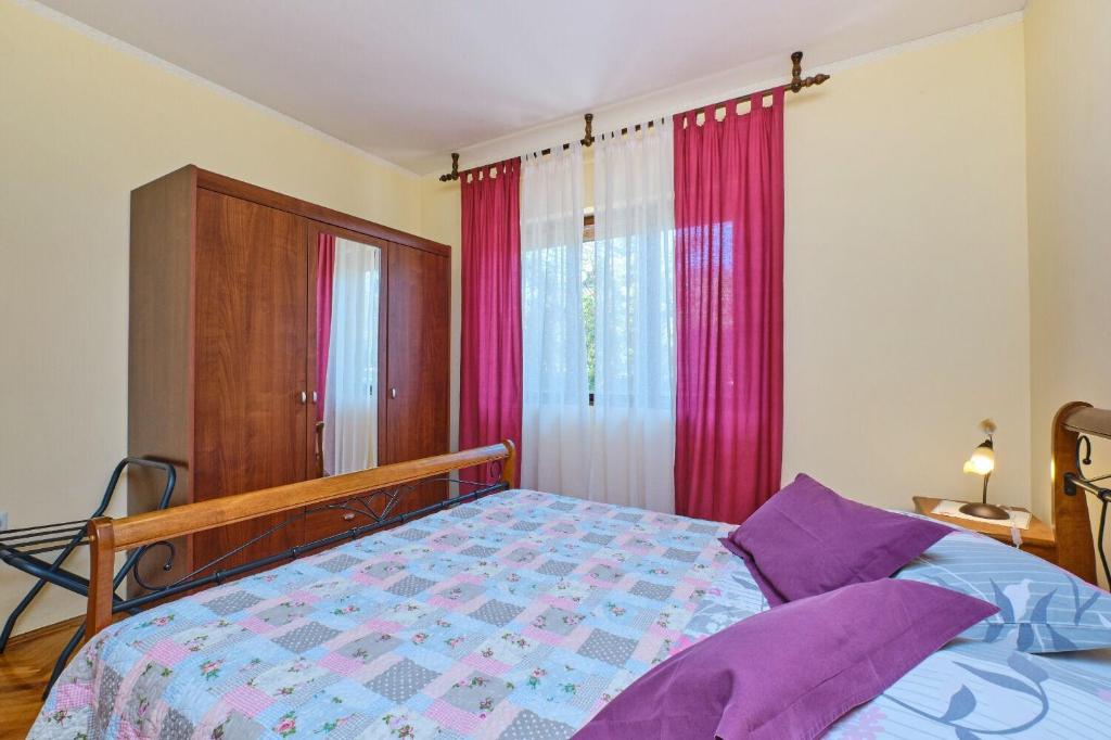 Posteľ alebo postele v izbe v ubytovaní Apartment Giuseppe