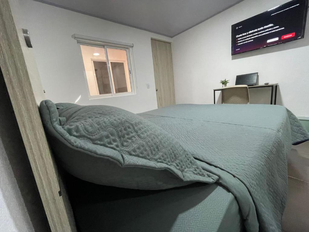 Postel nebo postele na pokoji v ubytování BogoRooms Av Suba 116