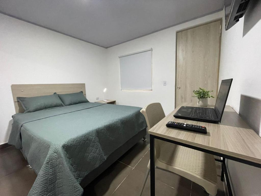 Postel nebo postele na pokoji v ubytování BogoRooms Av Suba 116