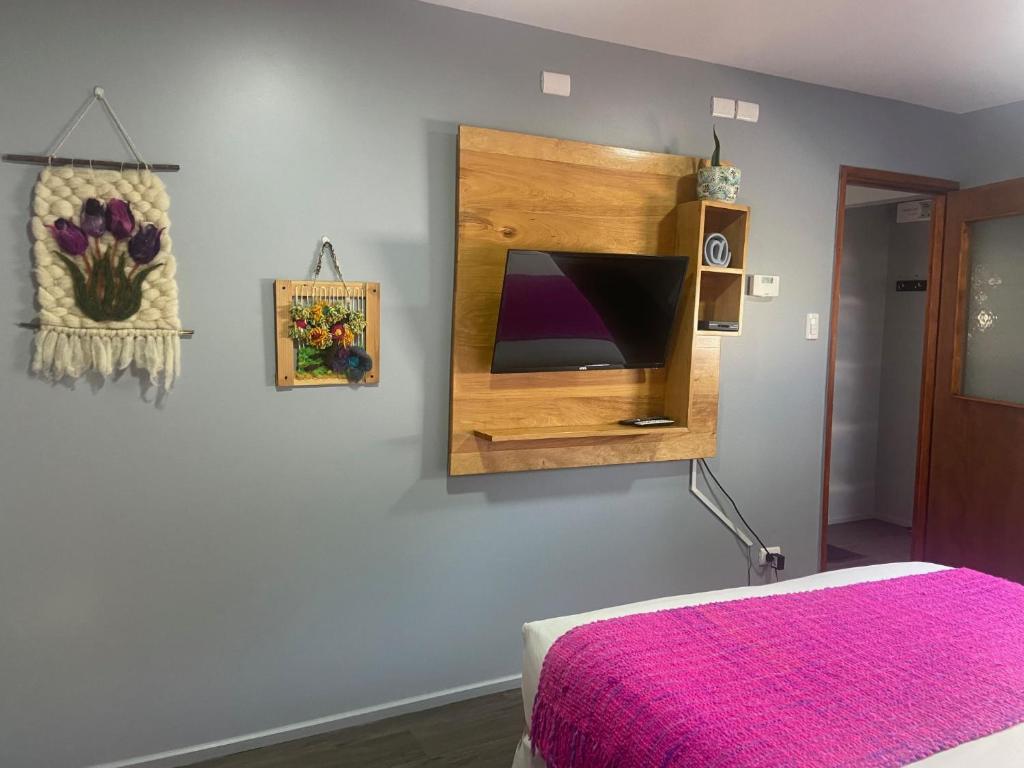 Uma cama ou camas num quarto em Cabañas Bosque Austral