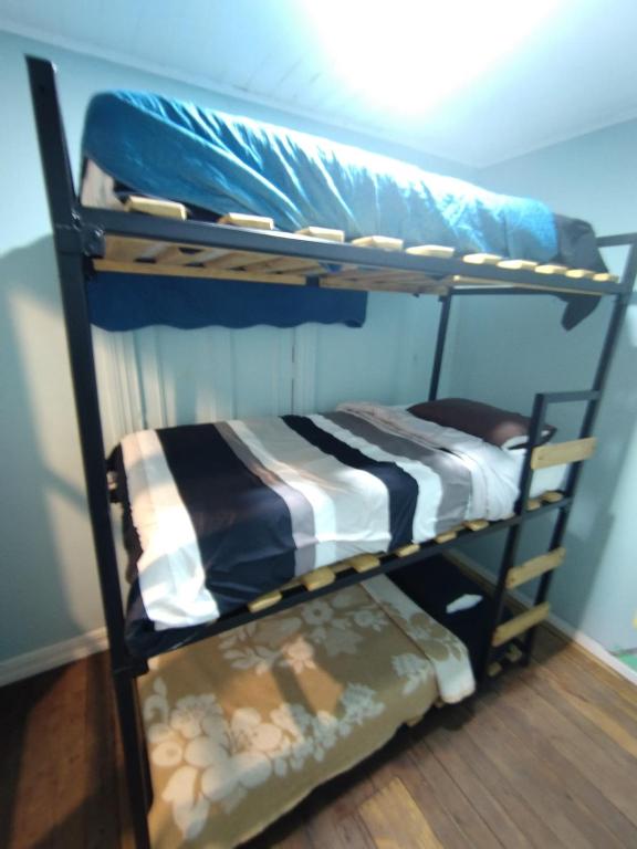 Postel nebo postele na pokoji v ubytování Hostal Perro Watón