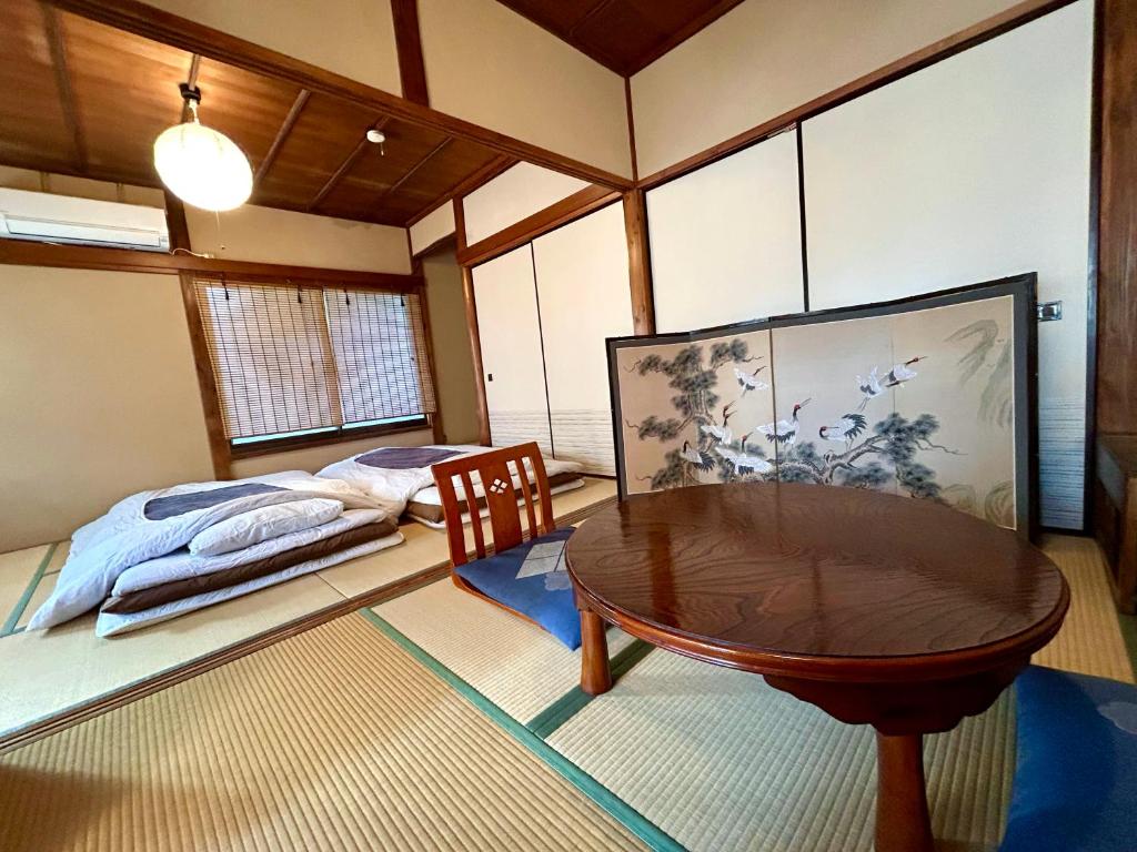 Postel nebo postele na pokoji v ubytování Japanese Traditional Inn Kamakura Rakuan