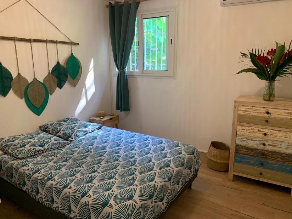Postel nebo postele na pokoji v ubytování Villa Coco Caraïbes