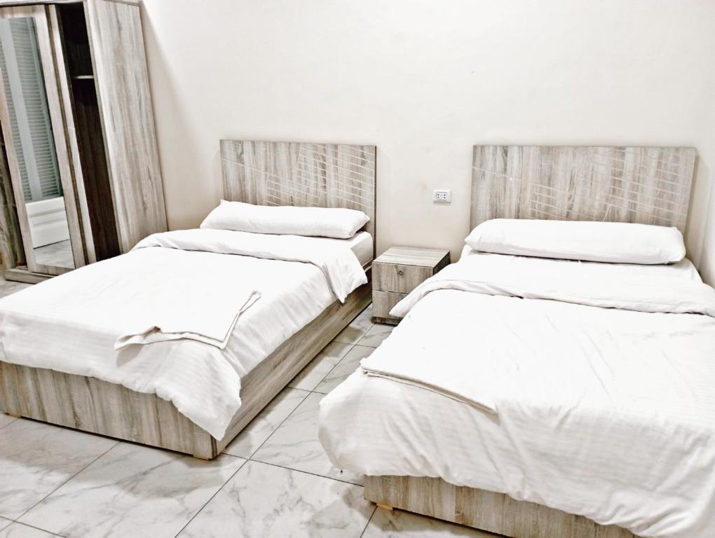 Postel nebo postele na pokoji v ubytování Cairo Crown Inn