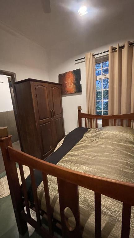 Postel nebo postele na pokoji v ubytování Pekoetrails Hantana Homestay