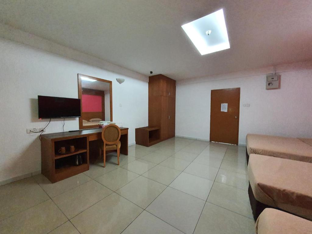 TV a/nebo společenská místnost v ubytování Cool Point Hotel