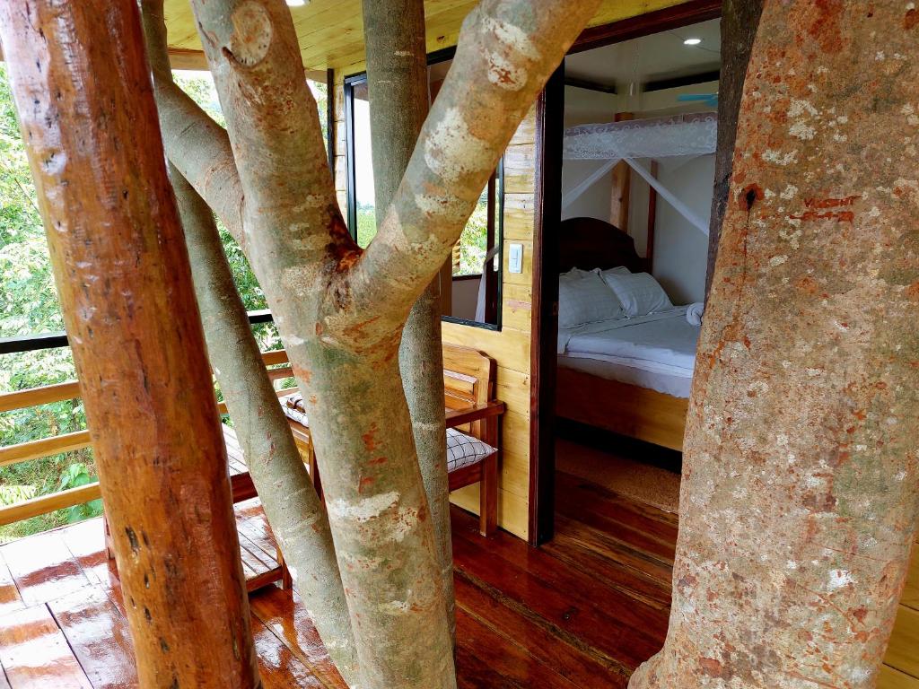 Postel nebo postele na pokoji v ubytování Jungle bar Resto & Cottages