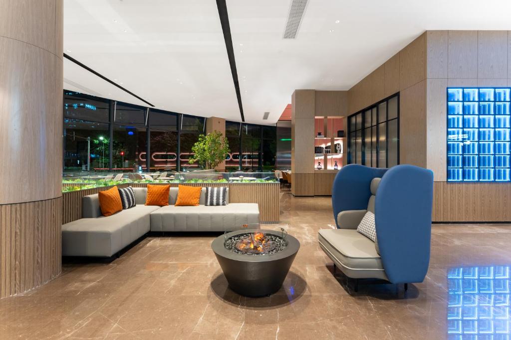 Posezení v ubytování Echarm International Hotel Guangzhou Baiyun International Airport Qingbu Metro Branch - Free Deliver Service to Guangzhou Baiyun International Airport & Free Deliver Service to Canton Fair Complex During Canton Fair Period