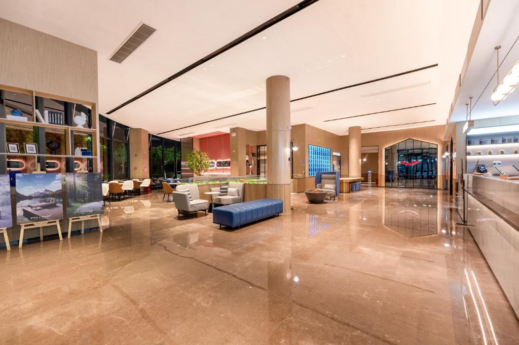Posezení v ubytování Echarm International Hotel Guangzhou Baiyun International Airport Qingbu Metro Branch - Free Deliver Service to Guangzhou Baiyun International Airport & Free Deliver Service to Canton Fair Complex During Canton Fair Period