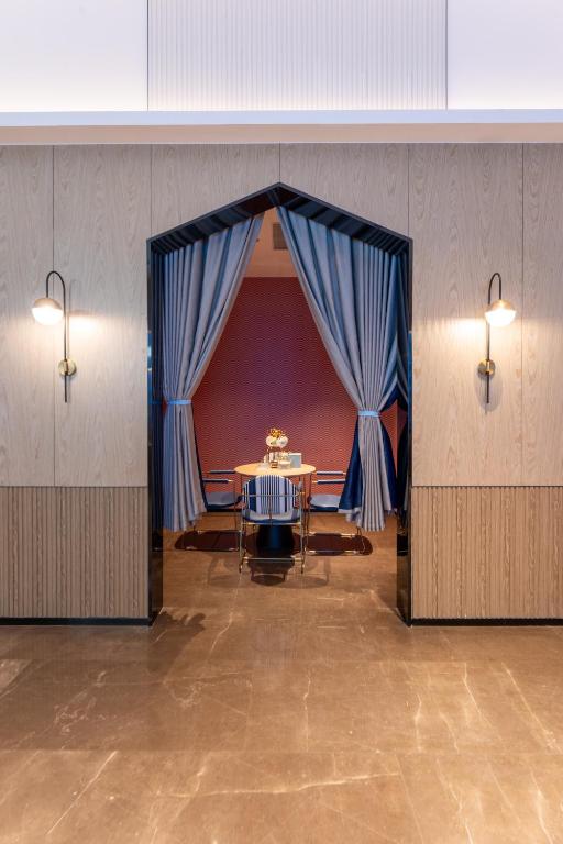 Posezení v ubytování Echarm International Hotel Guangzhou Baiyun International Airport Qingbu Metro Branch - Free Deliver Service to Guangzhou Baiyun International Airport & Free Deliver Service to Canton Fair Complex During Canton Fair Period