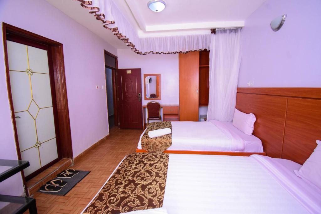 Postel nebo postele na pokoji v ubytování Sunstar Hotel Nairobi