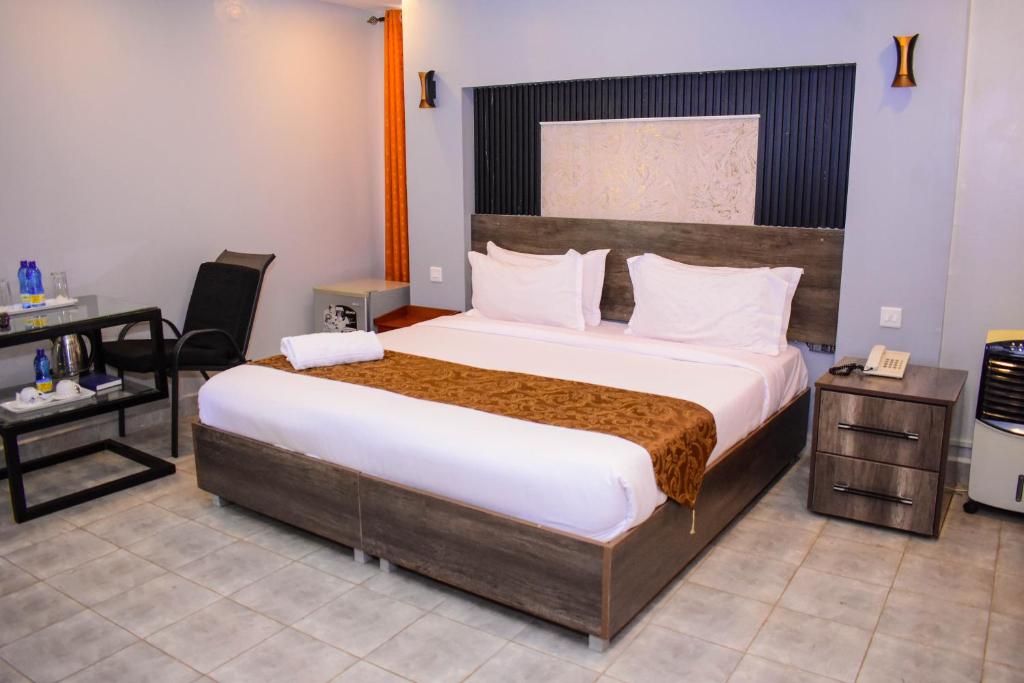 Postel nebo postele na pokoji v ubytování Sunstar Hotel Nairobi