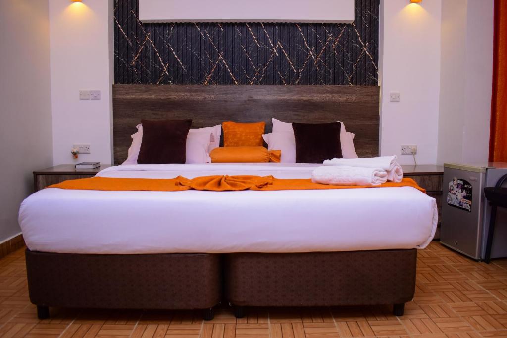 Postel nebo postele na pokoji v ubytování Sunstar Hotel Nairobi