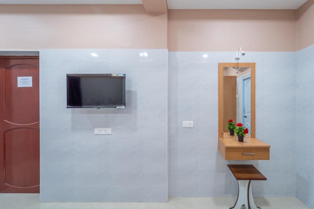 TV a/nebo společenská místnost v ubytování Sam Residency