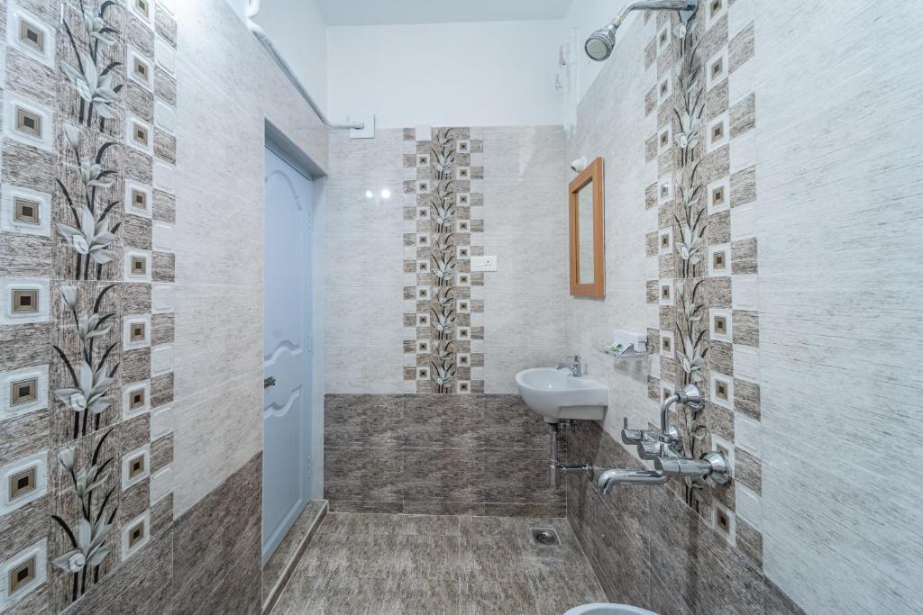 Koupelna v ubytování Sam Residency