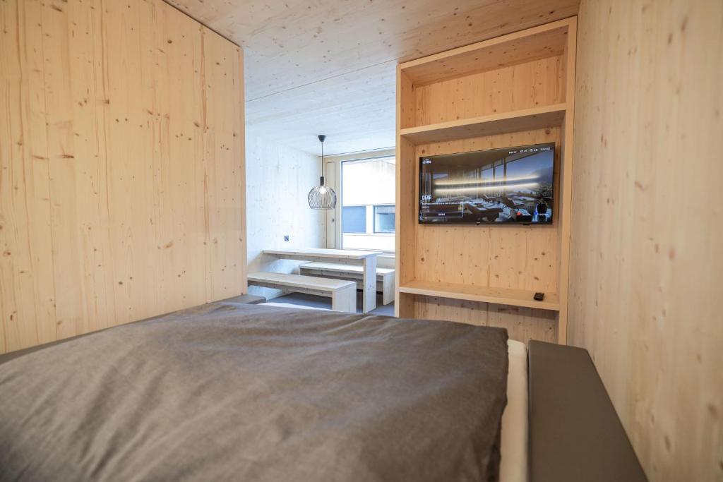 Postel nebo postele na pokoji v ubytování Revier Mountain Lodge Saas-Fee