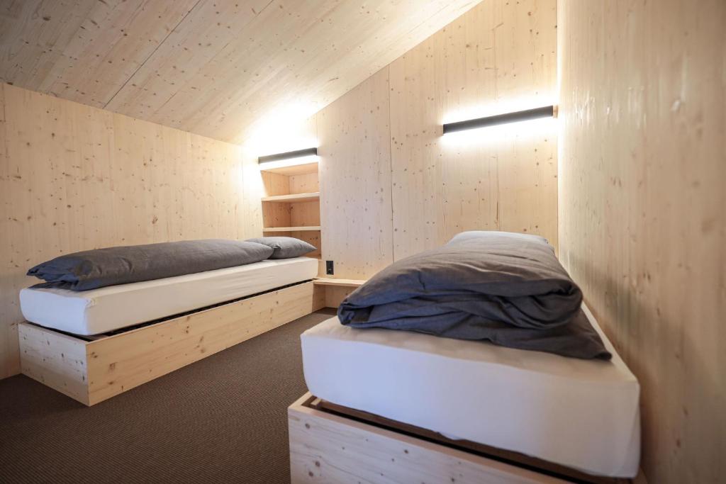 Postel nebo postele na pokoji v ubytování Revier Mountain Lodge Saas-Fee