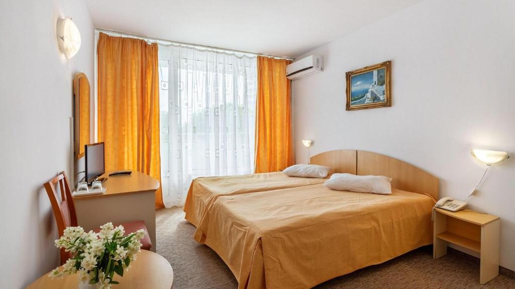 Postel nebo postele na pokoji v ubytování Hotel AquaPark Balada Saturn - ULTRA ALL INCLUSIVE
