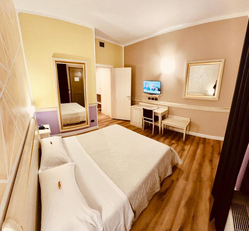 Postel nebo postele na pokoji v ubytování Hotel Malpensa INN Aereoporto