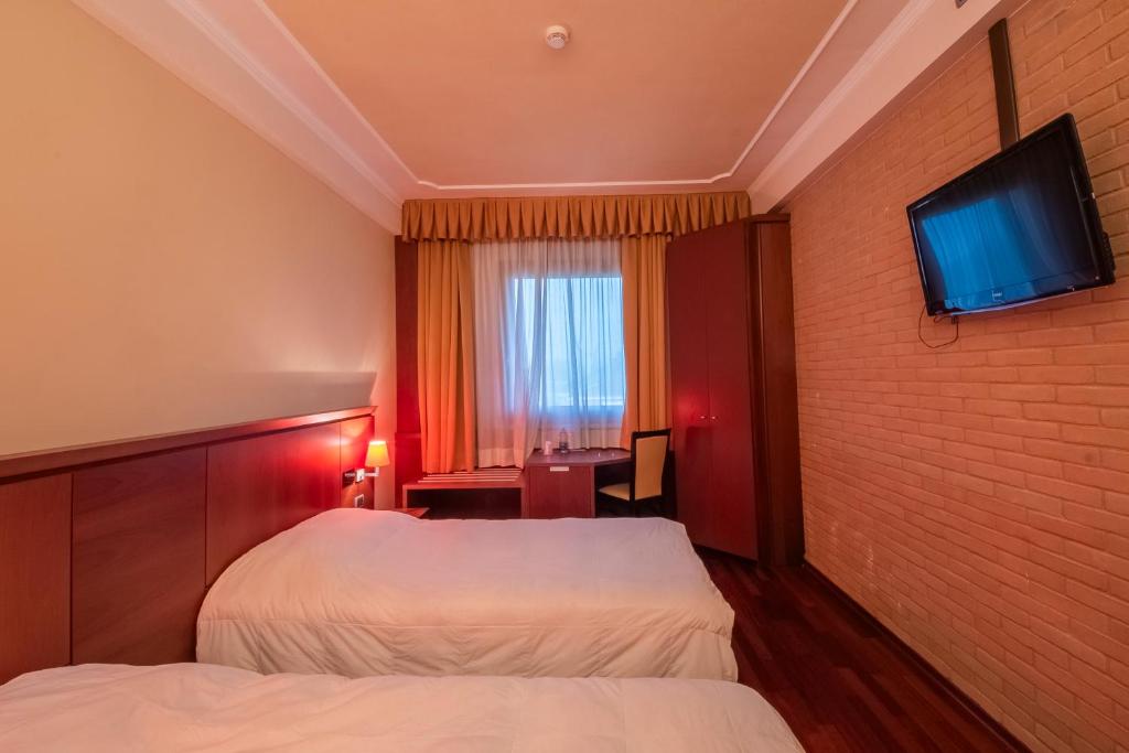 TV a/nebo společenská místnost v ubytování Dado Hotel International