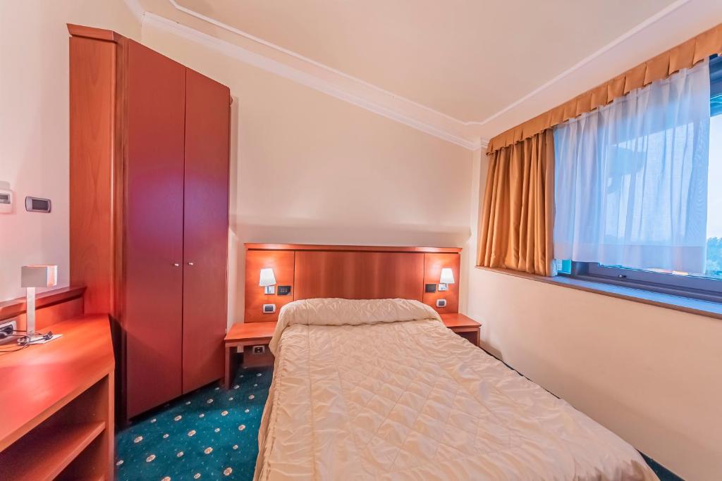 Postel nebo postele na pokoji v ubytování Dado Hotel International