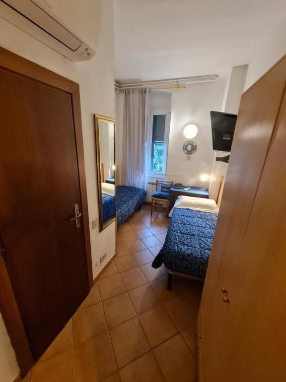 Postel nebo postele na pokoji v ubytování Albergo Genio