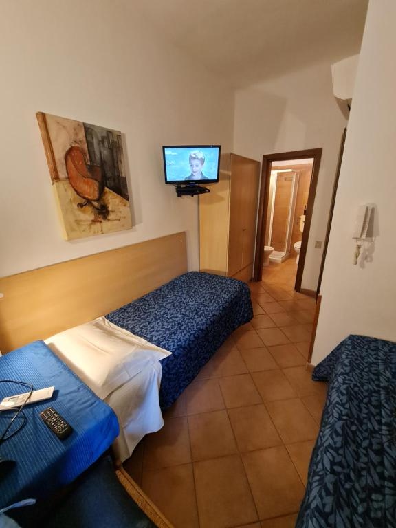 Postel nebo postele na pokoji v ubytování Albergo Genio