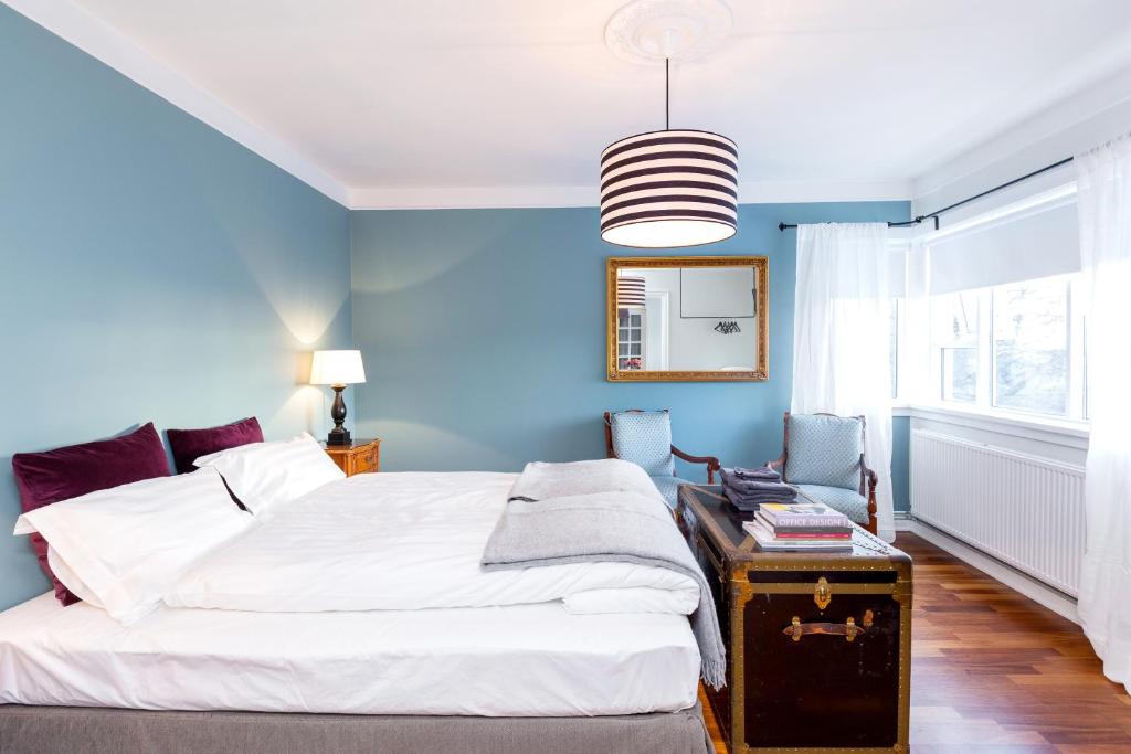 Postel nebo postele na pokoji v ubytování Freyja Guesthouse & Suites
