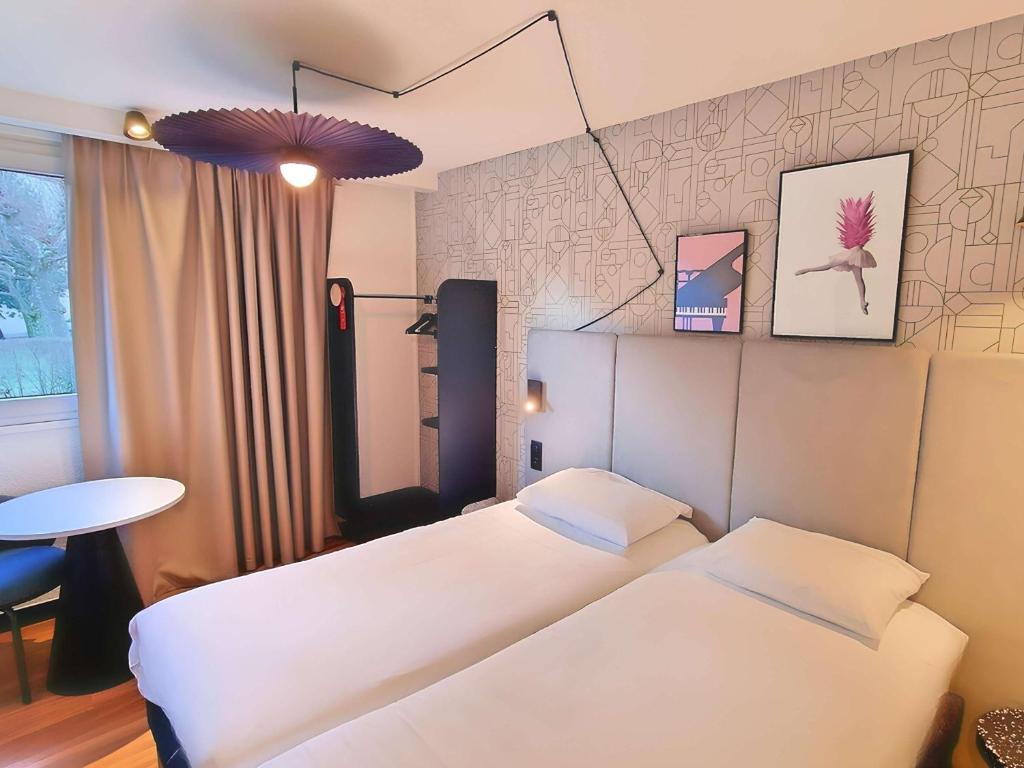 Postel nebo postele na pokoji v ubytování Ibis Sallanches Porte du MontBlanc