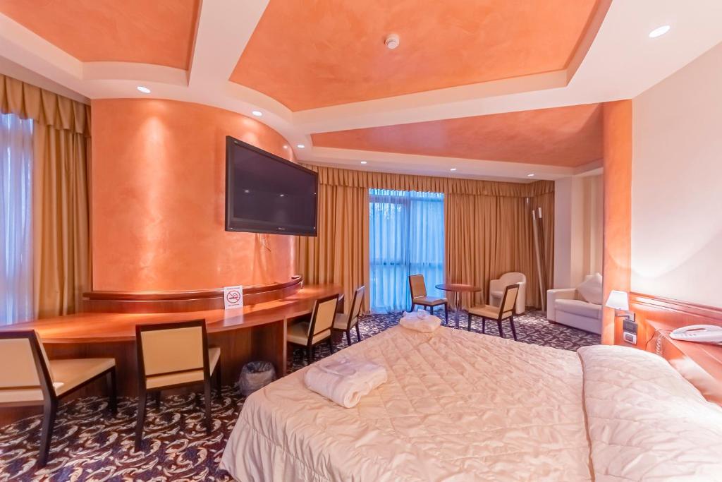 Postel nebo postele na pokoji v ubytování Dado Hotel International
