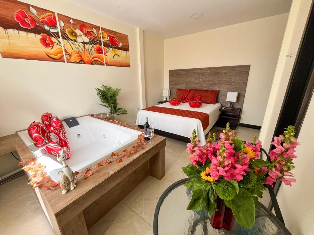 Postel nebo postele na pokoji v ubytování Hotel Las Mercedes Airport-Quito