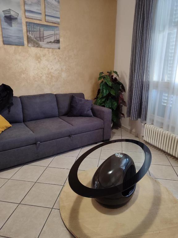 a black hat on a table in a living room at Diana's home in Empoli