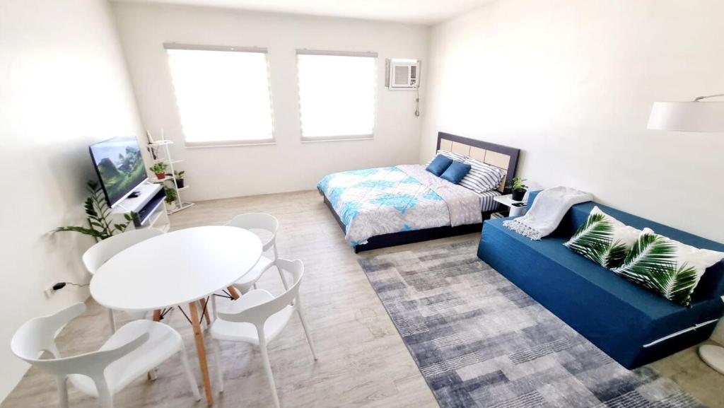 Ένα ή περισσότερα κρεβάτια σε δωμάτιο στο Joms Minimalist Crib Nuvali