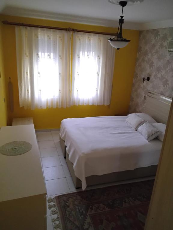 Postel nebo postele na pokoji v ubytování Havuzlu Beyaz villa