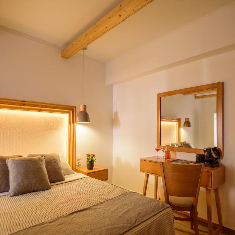 Postel nebo postele na pokoji v ubytování Karidis Hotel