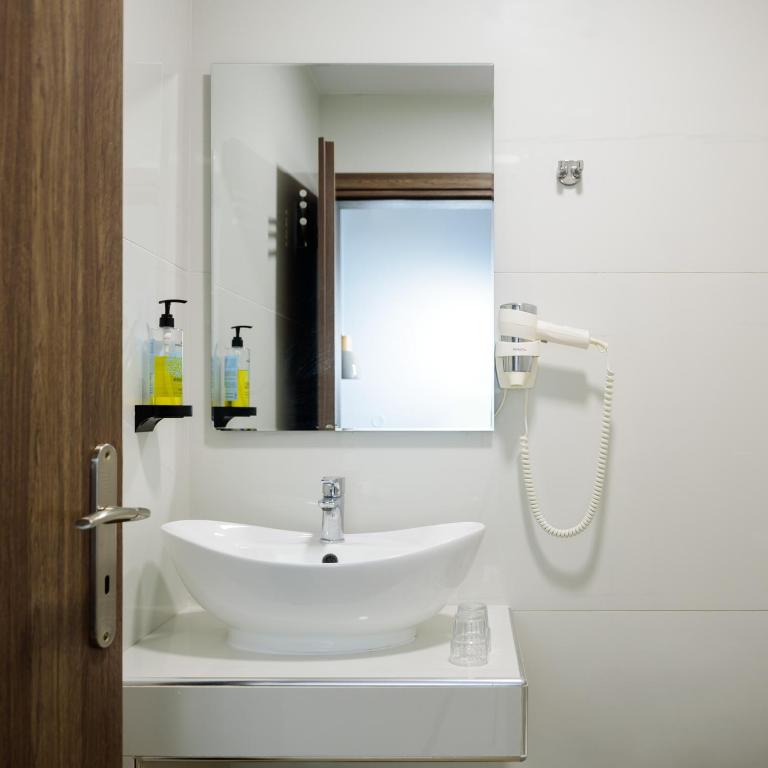 Koupelna v ubytování Karidis Hotel