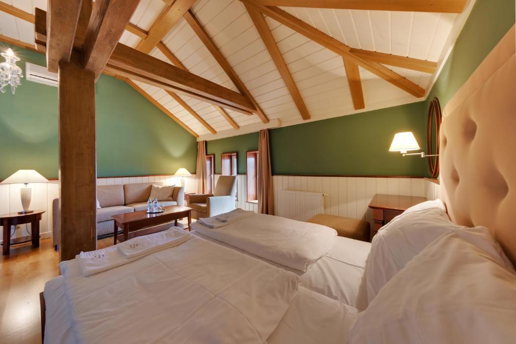 Postel nebo postele na pokoji v ubytování Hotel Torysa