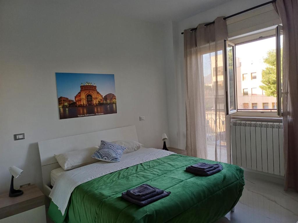 Ένα ή περισσότερα κρεβάτια σε δωμάτιο στο Villa Tàsca Apartment