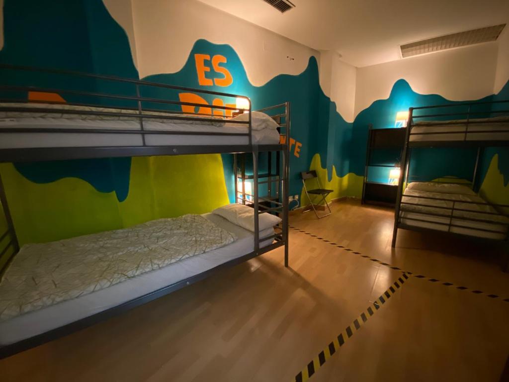 A bed or beds in a room at Bed Madrid Rooms by Bossh! Hotels